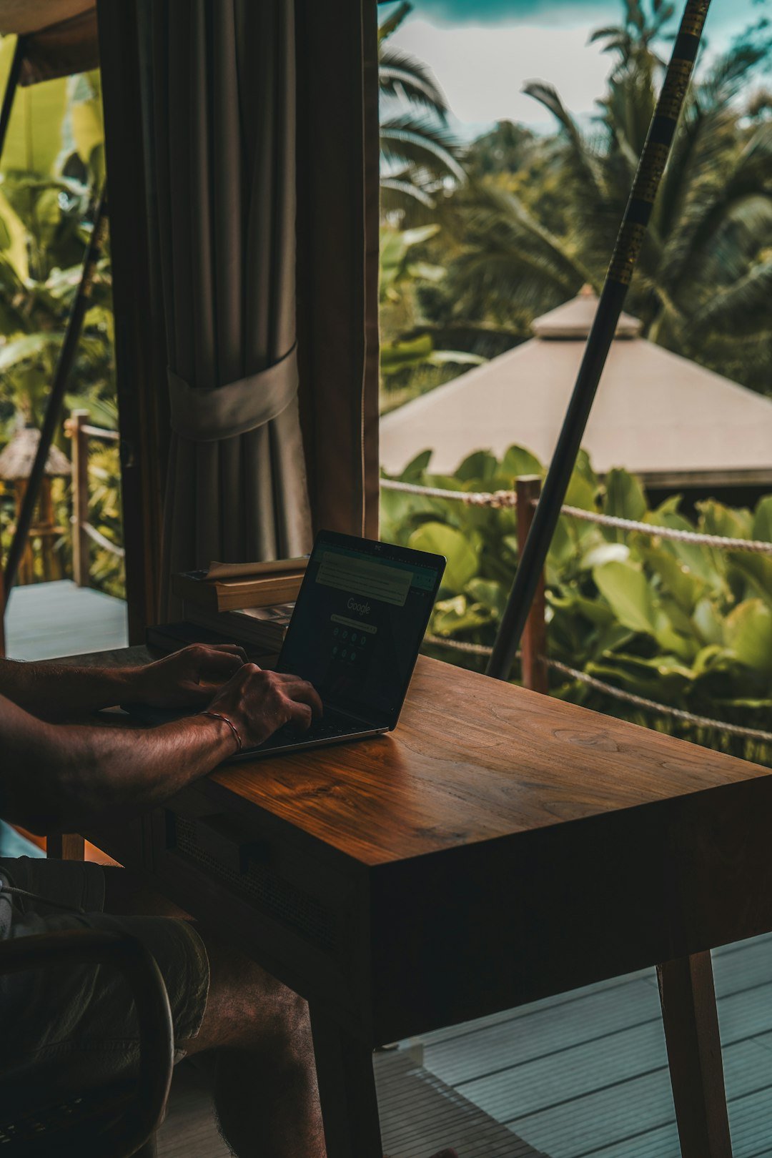 Person planning a holiday trip using a laptop