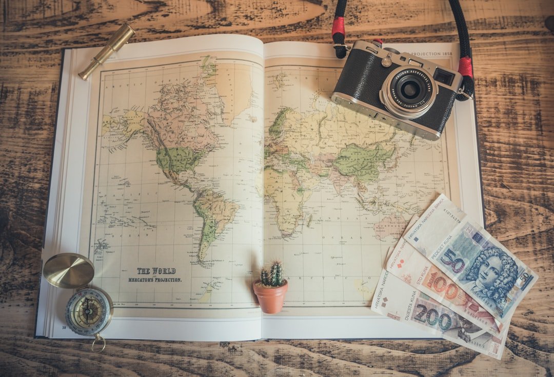 Travel planning with world map and compass