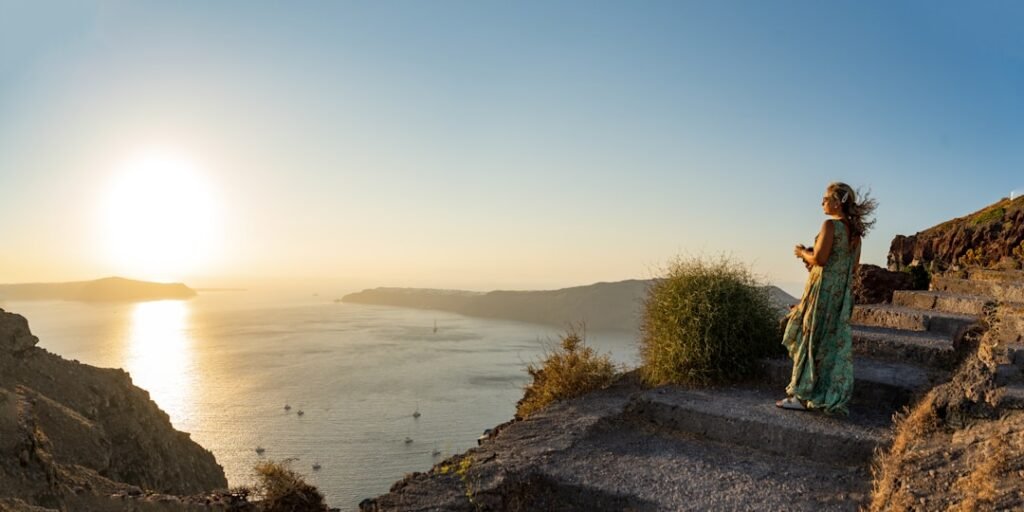 Romantic couple watching sunset in Santorini Greece