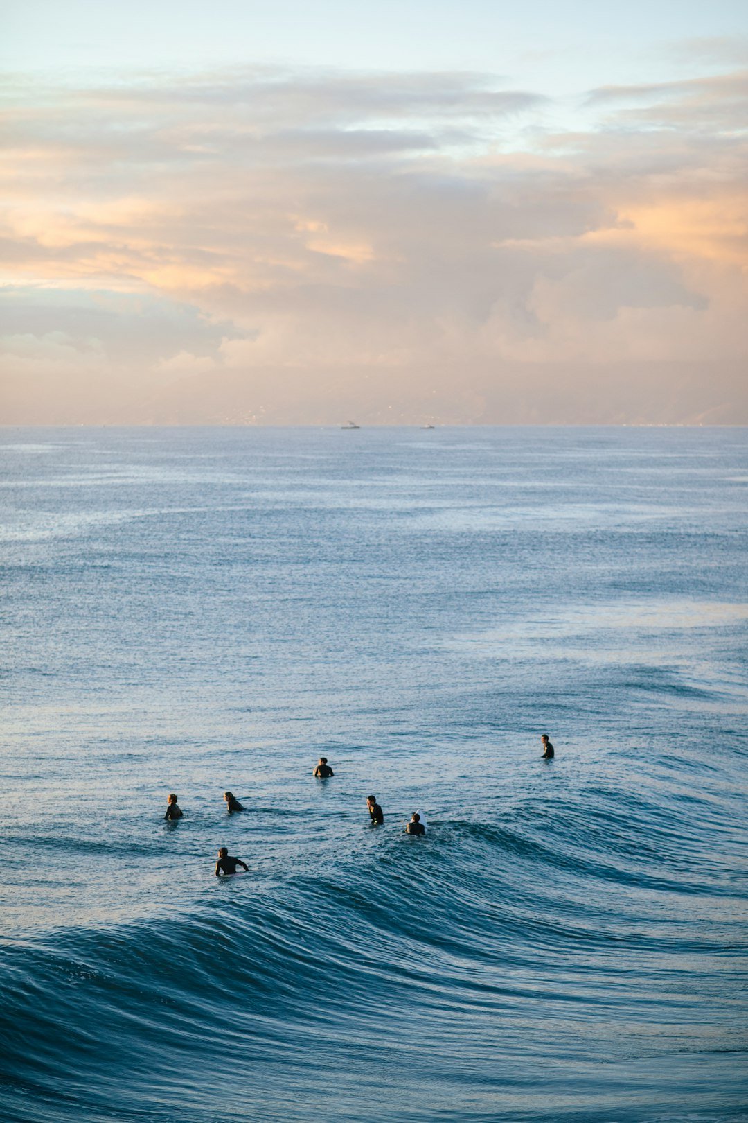 Surfer at California beach during a golden sunset