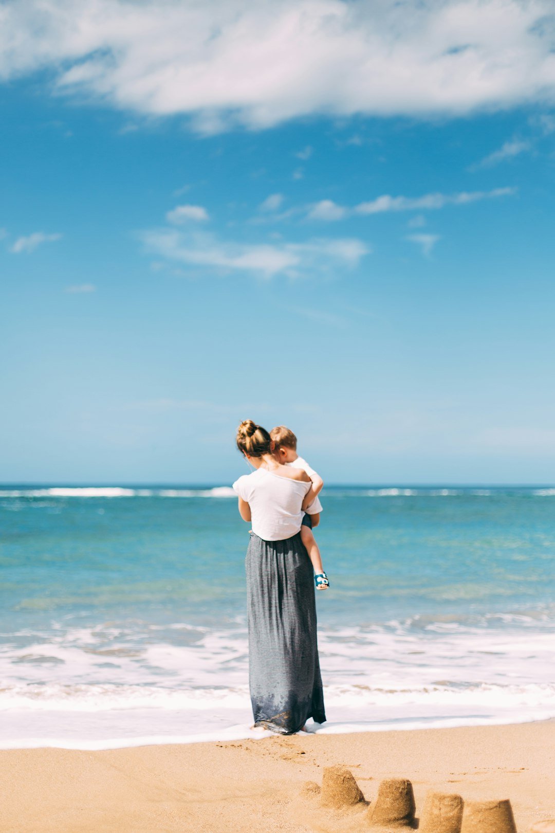 Family with kids on a tropical beach holiday