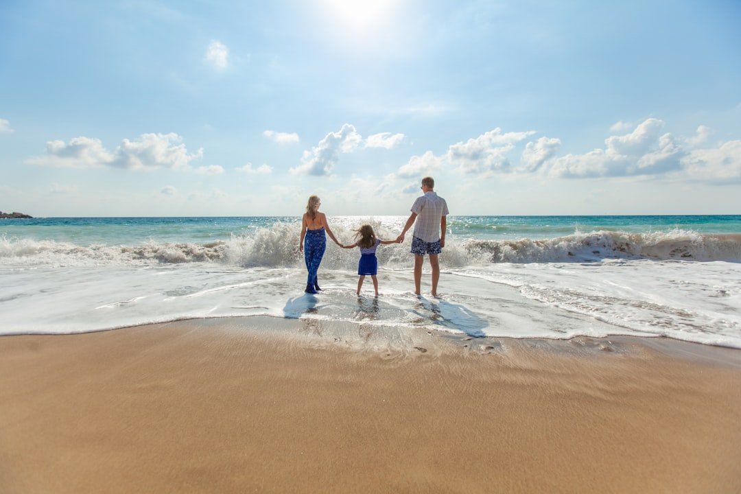 Family enjoying a beach holiday with kids