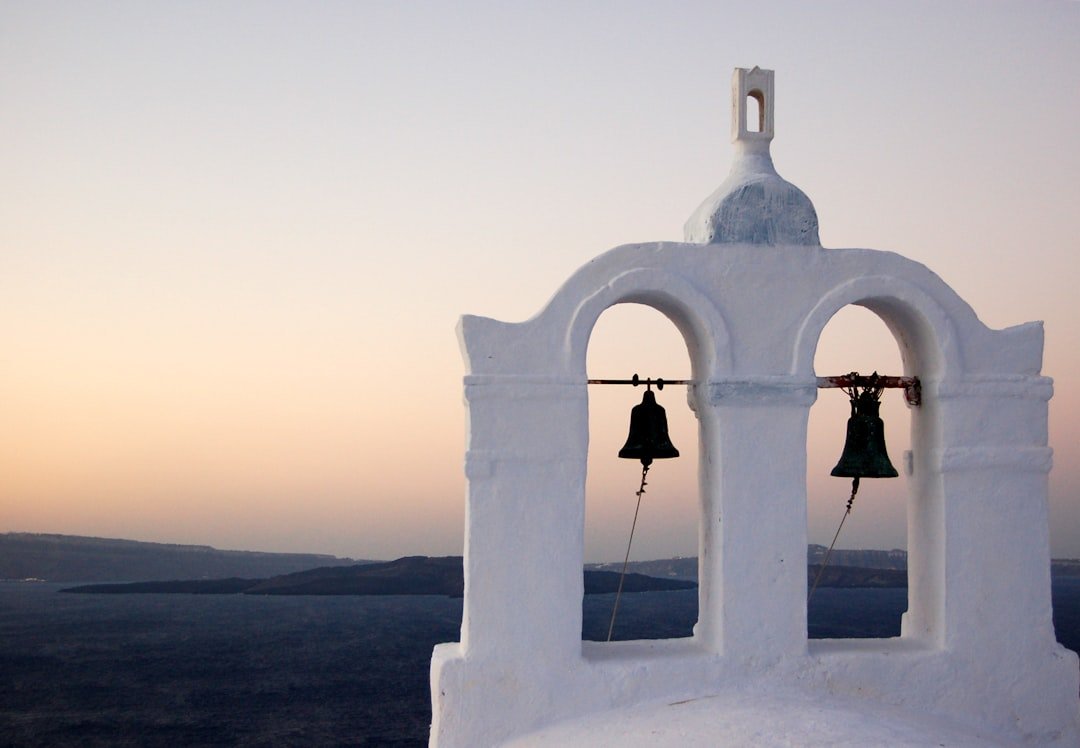 Santorini Greece white blue dome sunset