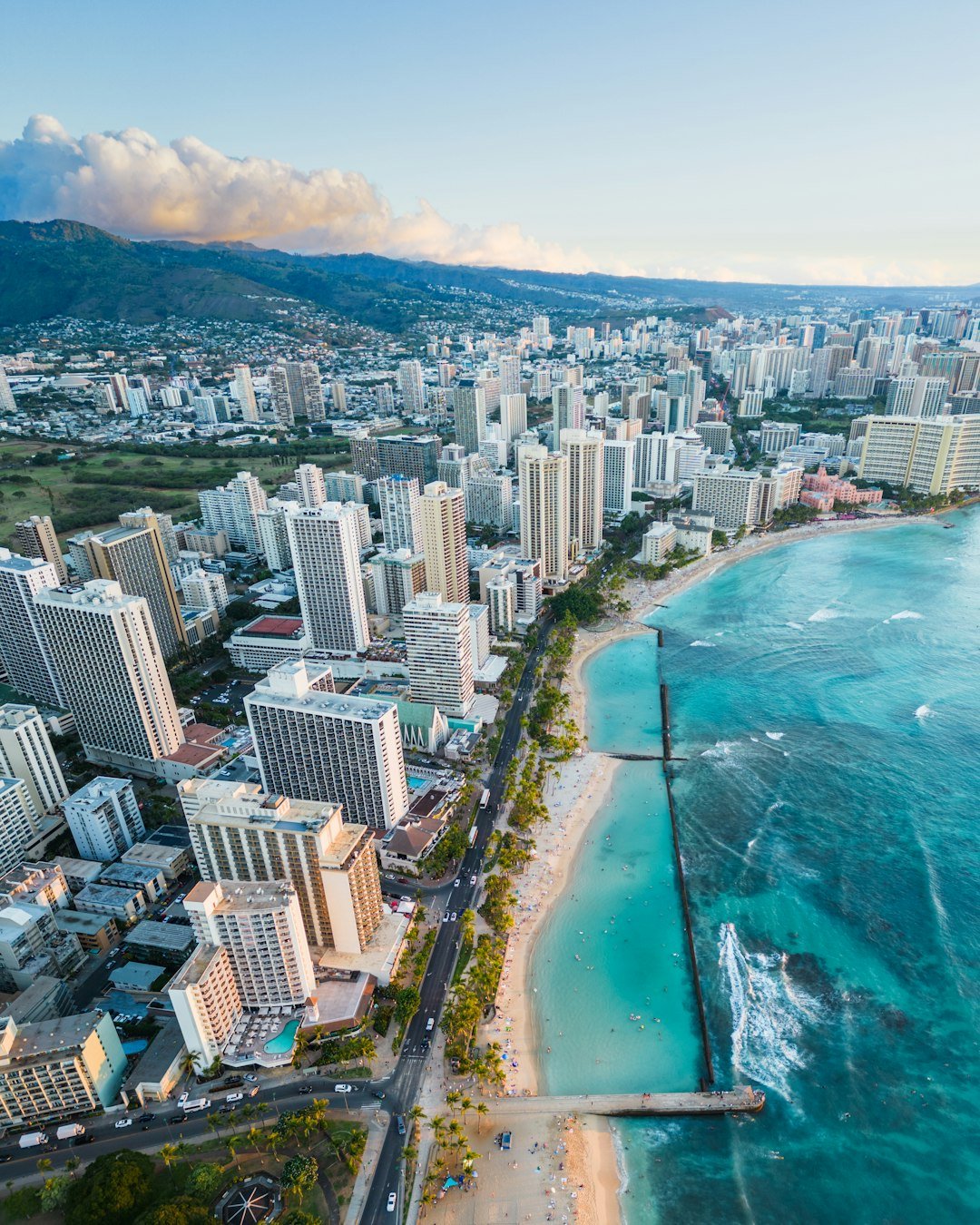 Surfing on Hawaii's Waikiki Beach with blue ocean
