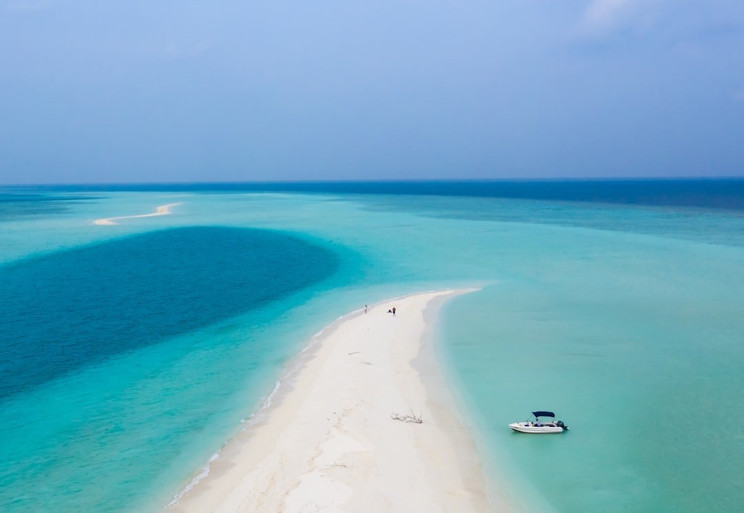 Aerial view of Maldives island surrounded by turquoise water
