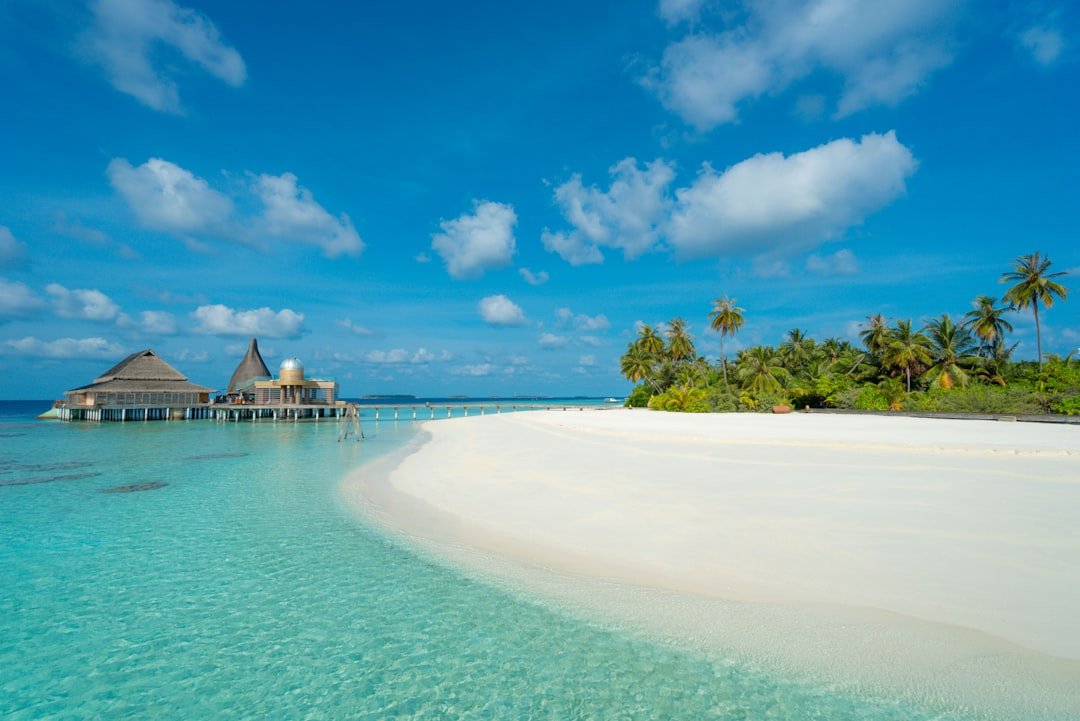 Overwater bungalow on a turquoise Maldives lagoon