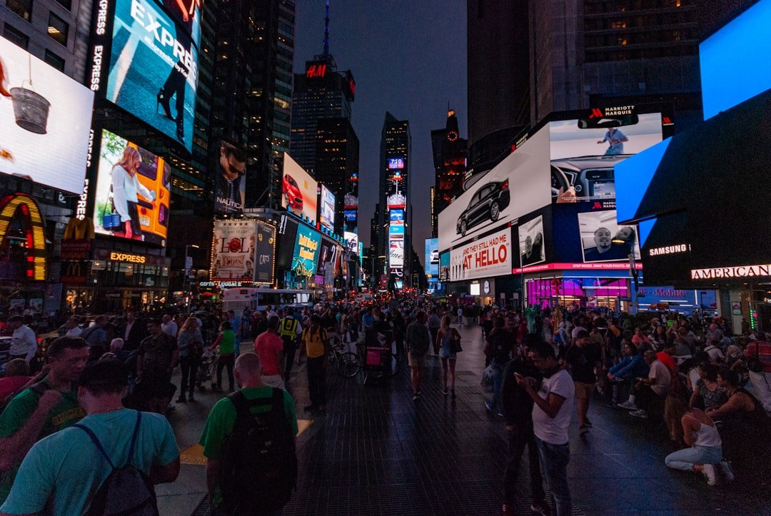 Times Square illuminated with neon lights at night in New York