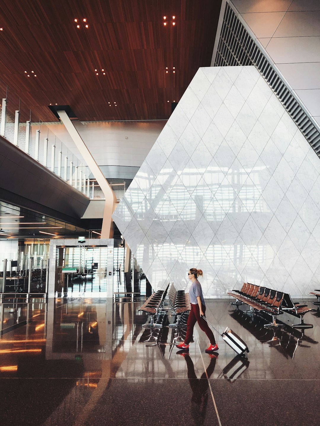 Person using smartphone at airport during travel