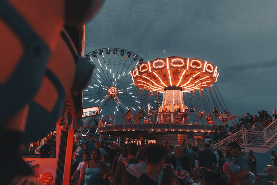 Theme park illuminated with colourful lights at night