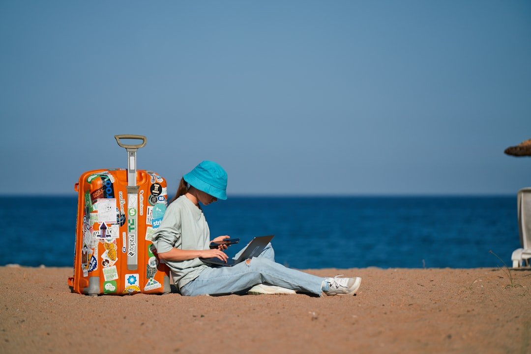 Digital nomad working with laptop and travel technology