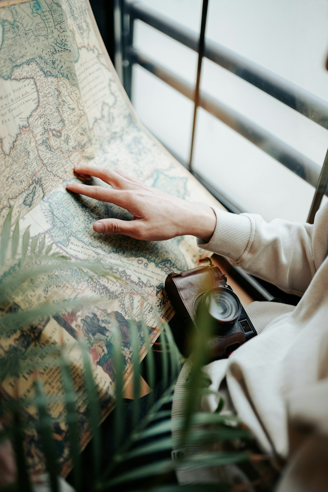 Woman reading a map while travelling solo