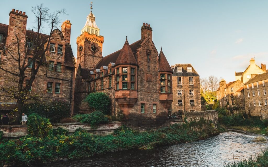 Historic stone buildings beside the water in Edinburgh