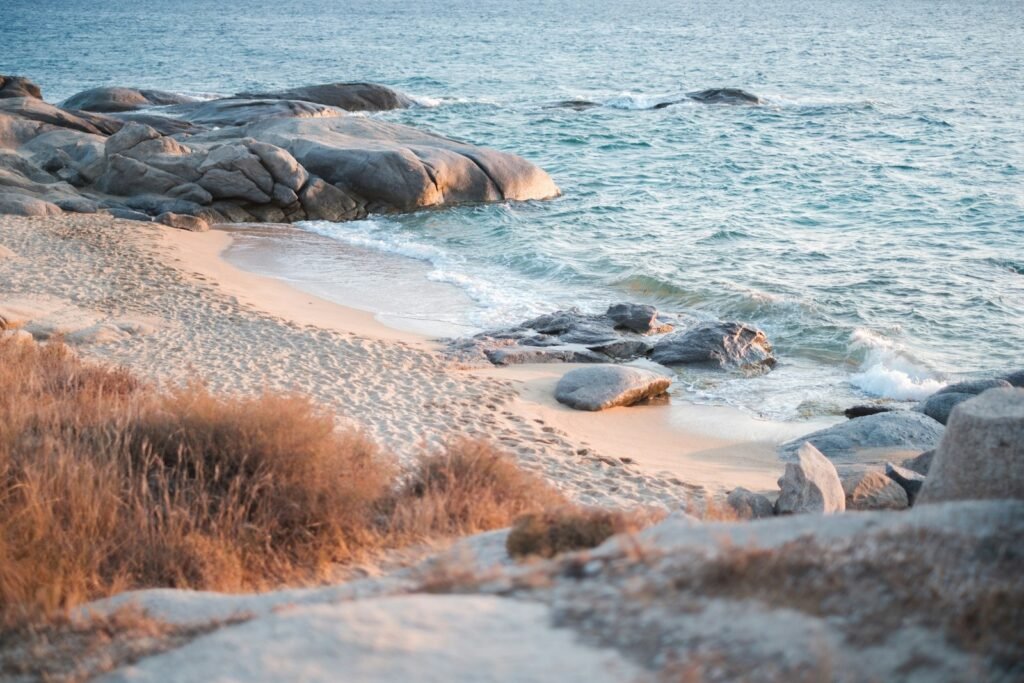 rock formations near body of water during daytime