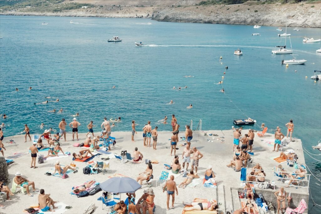 a large group of people are on the beach